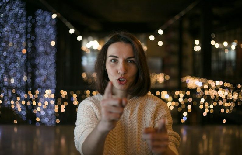 Listening Skills - a woman making a funny face with her finger