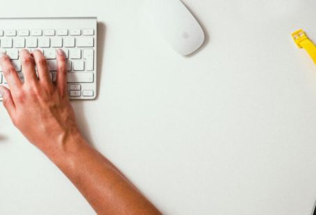 Volunteer Manage - person typing on Apple Cordless Keyboard