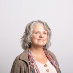 Age Diversity - a woman with grey hair wearing a brown cardigan