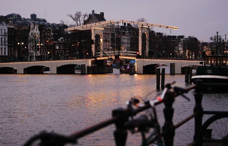 Channels Effective - a bridge over a body of water with lights on it