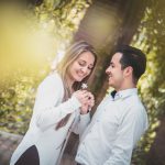 Introverts Engage - man giving white flower to woman surrounded by green trees