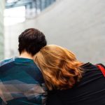 Burnout Recovery - a woman rests her head on another person's shoulder