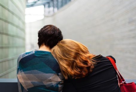 Burnout Recovery - a woman rests her head on another person's shoulder