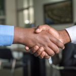 Trust Handshake - two people shaking hands