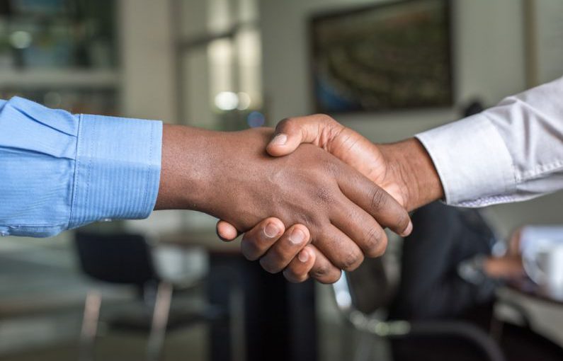 Trust Handshake - two people shaking hands