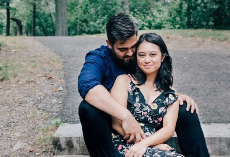 Seniors Engaged - man wearing blue dress shirt and black pants and woman in black floral dress