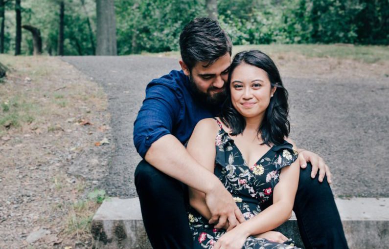 Seniors Engaged - man wearing blue dress shirt and black pants and woman in black floral dress