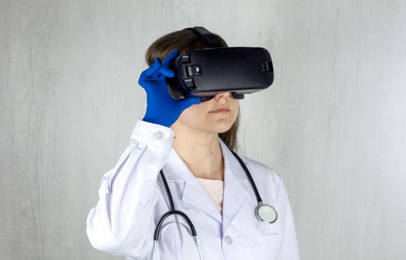 Vision Reality - a woman in a white coat and blue gloves is wearing a virtual headset