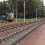 Crowdfunding Platform - a train traveling down train tracks next to a forest