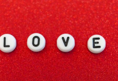 Message Craft - the word love spelled out in small letters on a red surface