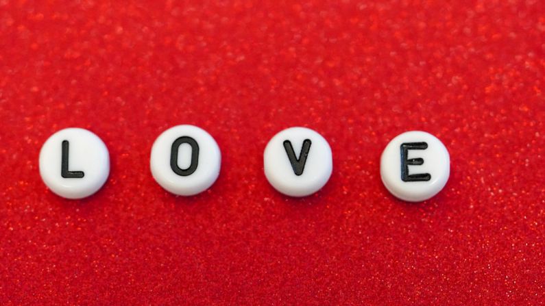 Message Craft - the word love spelled out in small letters on a red surface