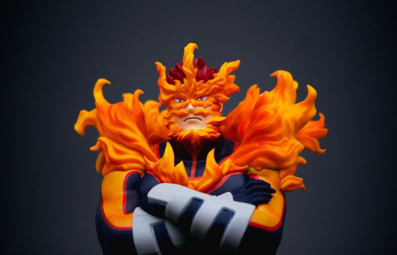 Apathy Action - a close up of a figurine of a person with fire on his face