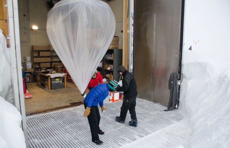 Timing Launch - white net balloon hanged above