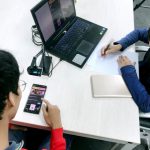 AB Testing - person in blue long sleeve shirt using black laptop computer